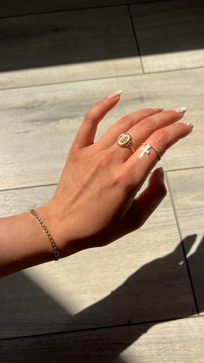 THE DANGLING CROSS RING